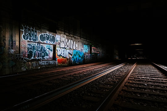 ‘Railway beside graffiti wall’ photo by Malcolm Lightbody